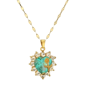 Gold necklace with green heart pendant featuring a central rose and diamond halo