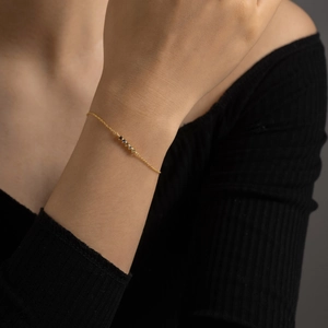Minimalist S925 silver gold chain bracelet with colorful zircon stones on woman's wrist