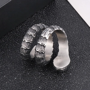 Macro view of vintage silver snake ring with detailed reptile scale texture