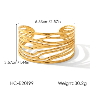 Detailed view of an 18K gold-plated irregular cutout cuff with exact size measurements