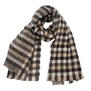 Close-up of classic black and white plaid knit scarf with soft tassel edges