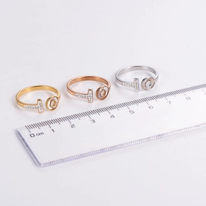 Minimalist T-letter rings in gold, rose gold, and silver with zircon micro-paving