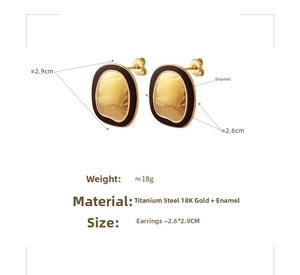 Detail of vintage gold textured oval earrings with black trim and 2.6x2.9cm dimensions