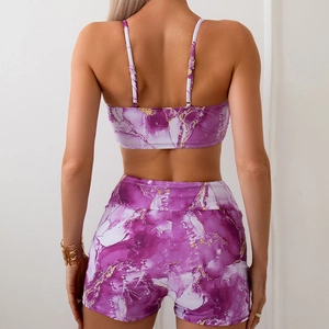 Detail of purple marble print on back of women's two-piece sports vest and yoga shorts