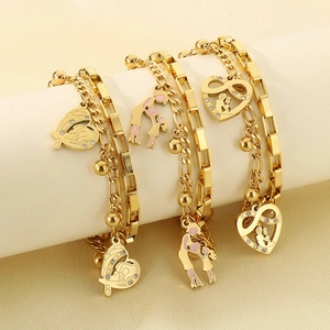 Detailed view of golden double-layer stainless steel bracelets with heart and family charms