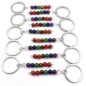 Handmade natural crystal bead keychains featuring seven chakra stones in a set of ten pieces
