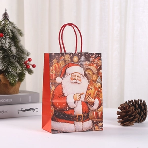 Christmas Santa Claus kraft paper gift bag with red rope handles and snowflake design