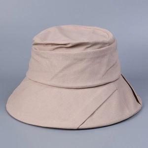 Detail of wide-brim cotton linen sun hat in beige with decorative folded edge design