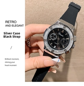 Detailed shot of a silver case watch with black strap and crystal-encrusted bezel