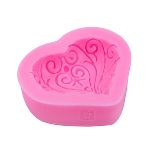 Pink heart-shaped silicone mold with floral texture for chocolate and baking crafts