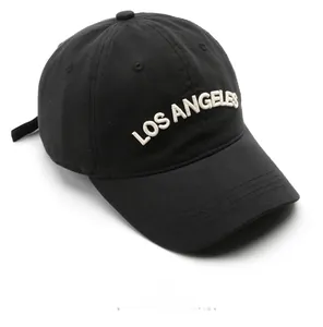 Detailed close-up of white 3D Los Angeles embroidery on a black cotton twill baseball cap