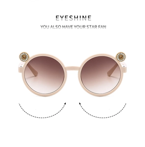 Close-up of cute kids rhinestone flower sunglasses detail, perfect outdoor sun protection.