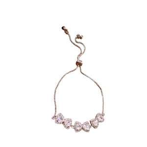 Rose gold adjustable heart bracelet featuring five sparkling cubic zirconia crystals