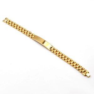 Macro detail of golden stainless steel tank watchband bracelet with polished plate