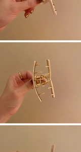 Detailed close-up of a premium beige and gold metal hair claw clip from multiple angles