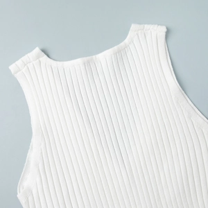Detailed close-up of premium white ribbed knit fabric texture and round neckline finish