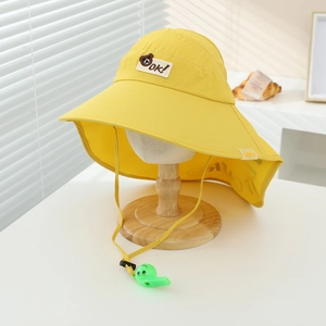 Detail of yellow kids sun hat with neck flap, wide brim, and bear patch embroidery