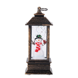 Vintage Christmas snow globe lantern with snowman figure and glittering snow effect