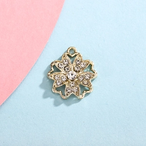 Top view of gold snowflake pendant with sparkling rhinestones for DIY jewelry