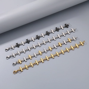 Men's titanium steel cross bracelets in silver, black, and gold finishes with lobster clasp