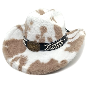 Detailed close-up of cow print cowboy hat with faux fur texture and star buckle