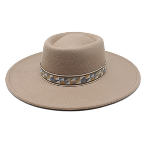 Detail of wool felt wide brim hat featuring a decorative geometric tribal pattern band