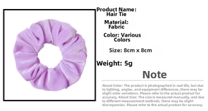 Macro view of purple sponge flower hair tie showing 8x8cm size and fabric texture