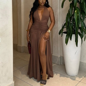 Detail view of deep V-neck and ruched waist on a brown sleeveless side slit dress