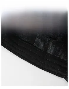 Detail of the widened sweatband with breathable woven texture on a black men's sports cap
