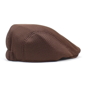 Detail view of breathable dark brown mesh fabric on a stylish lightweight ivy flat cap