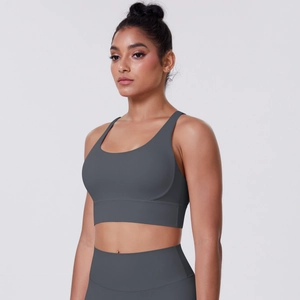 Detail of dark grey sports bra set with high-waist yoga leggings and wide shoulder straps