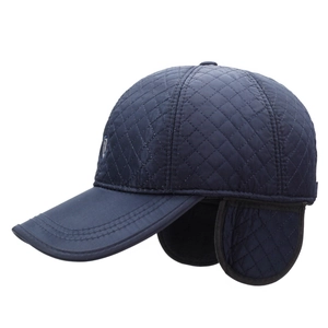 Navy blue quilted winter baseball cap with ear flaps and diamond pattern for men