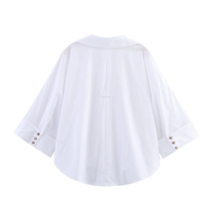 Rear view of white poplin shirt featuring wide sleeves and three buttons on cuffs