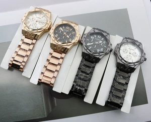 Detail of four DILUOHAO men's quartz watches with steel bands and three-eye dial design