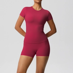 Detail of magenta seamless sports set showing high-elasticity fabric texture and slim fit