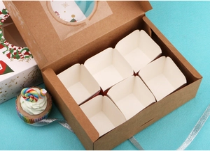 Top view of a kraft cupcake box with 6 slots, clear window, and white inserts on blue background
