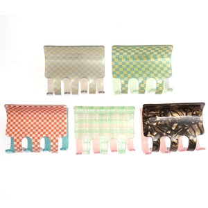 Five assorted checkered and tortoiseshell square hair claws in vibrant colors for women