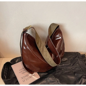 Chic dark brown faux leather hobo bag with olive green strap and gold metal hardware