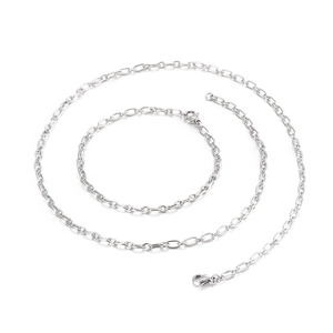 Minimalist silver geometric chain necklace in a elegant spiral display on white background