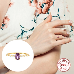 S925 Sterling silver gold-plated ring with oval purple gemstone and side diamonds