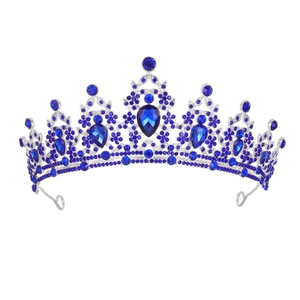 Detailed front view of silver crown with dark blue pear-cut rhinestones and crystals