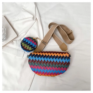 Detail of woven crossbody bag with colorful zigzag patterns and a matching mini coin purse