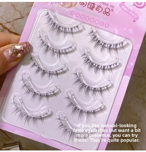 Detailed close-up of five pairs of handmade natural false eyelashes with clear bands