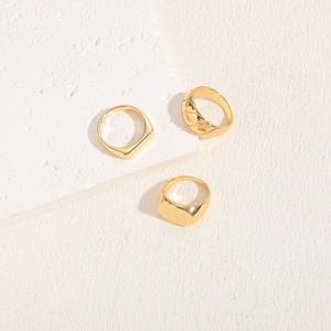 Three-piece geometric 14K gold plated rings set with minimalist textured bands