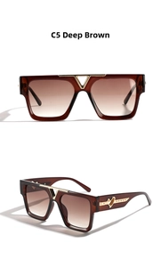 Detail view of square sunglasses with V-shaped gold metal bridge and heart temple design