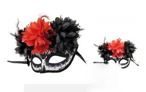 Detail of Day of the Dead mask with red and black silk flowers and delicate lace trims