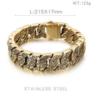 Detailed view of gold vintage Cuban link bracelet with intricate pattern engravings