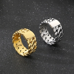 Detail of silver and gold stainless steel rings with unique woven chain texture design