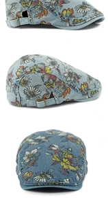 Detailed views of denim beret with floral patterns and bronze adjustable buckle