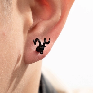 Cool black stag head stud earring in stainless steel shown worn on a male earlobe